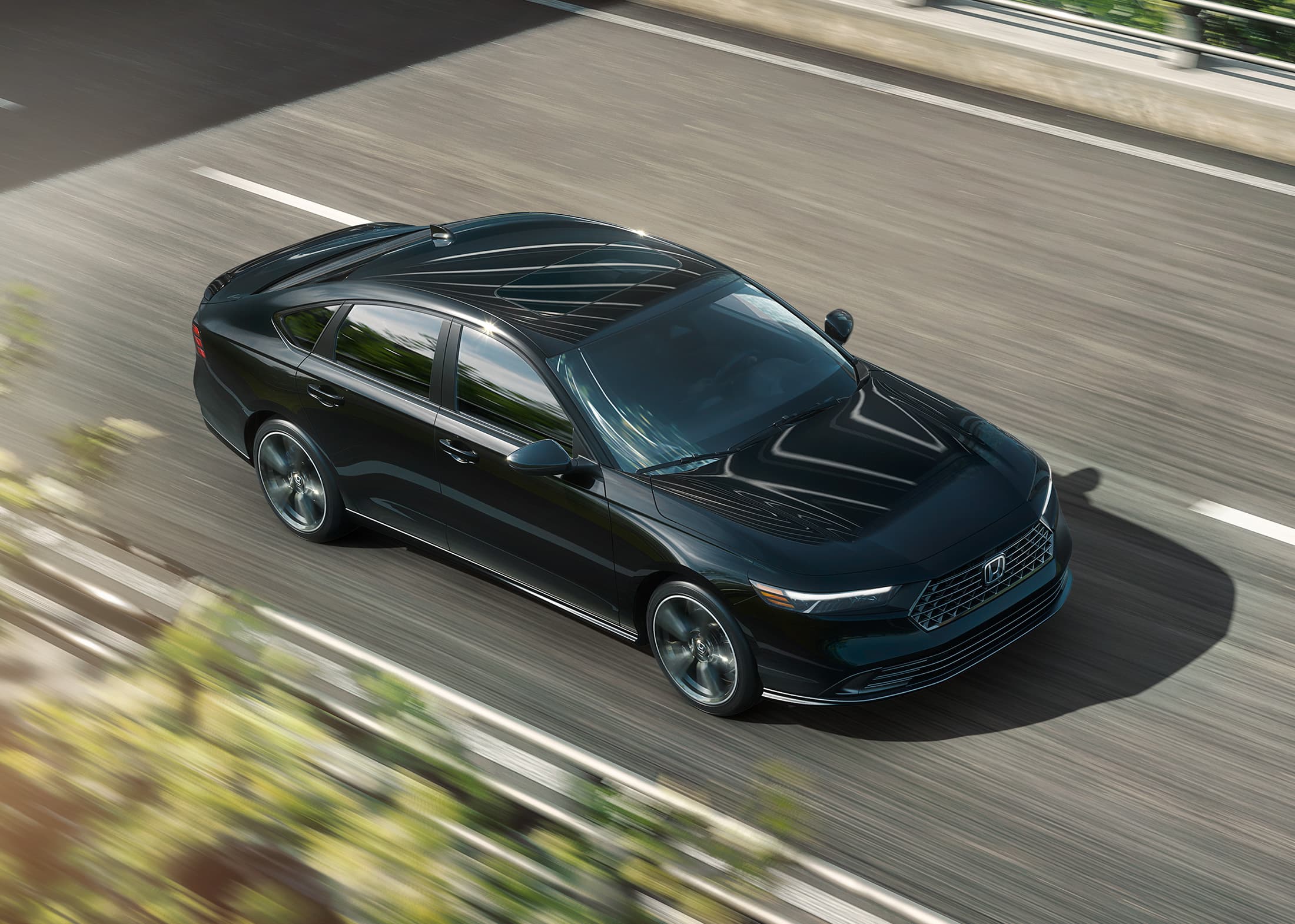 2026 Honda Accord in Crystal Black Pearl driving along overpass.