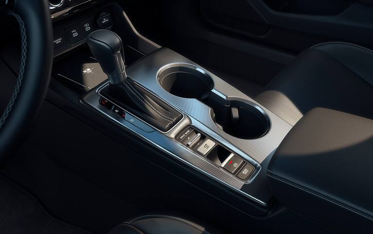 2027 Honda Civic Hatchback center console with gear shift and cup holders (Compact Hatchback).